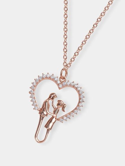 A rose gold heart-shaped pendant featuring a couple's silhouette. This type of clear, detailed shot is essential for intricate and sentimental jewelry pieces.