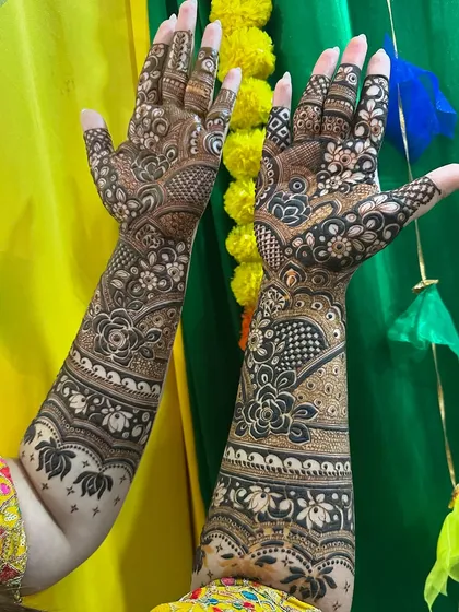Another angle of the floral engagement design, showing how it adorns the hands from all sides.