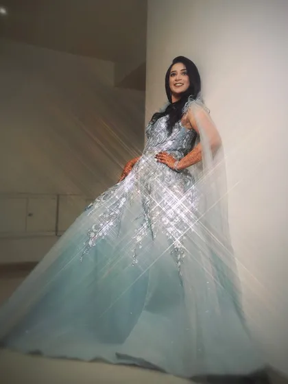 An artistic portrait of the bride in her engagement gown, with a starburst filter effect that adds a touch of magic and glamour to the image.