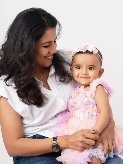 A mother's gentle gaze at her daughter. The connection between them is so clear in this sweet and simple portrait.