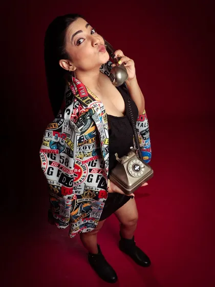 A cute and expressive pose, blowing a kiss to the camera. It's a fun, high-energy shot that stands out.