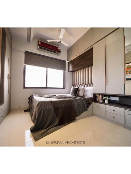 This parent's bedroom is a cozy retreat, with a comfortable bed and ample storage. The design is clean and functional, with a focus on creating a restful environment.