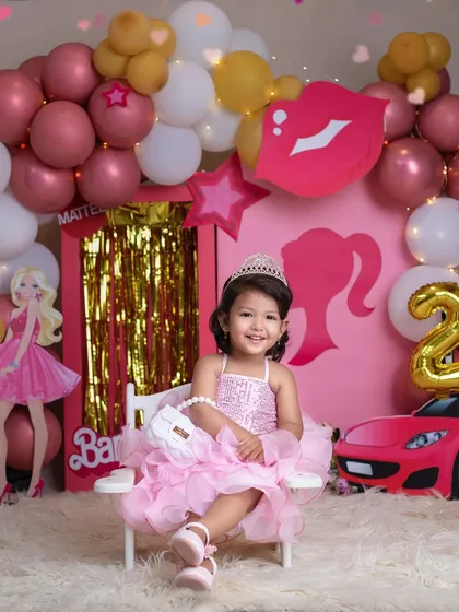 I'm a Barbie girl! This little princess is living her dream in a fabulous pink Barbie-themed birthday setup.