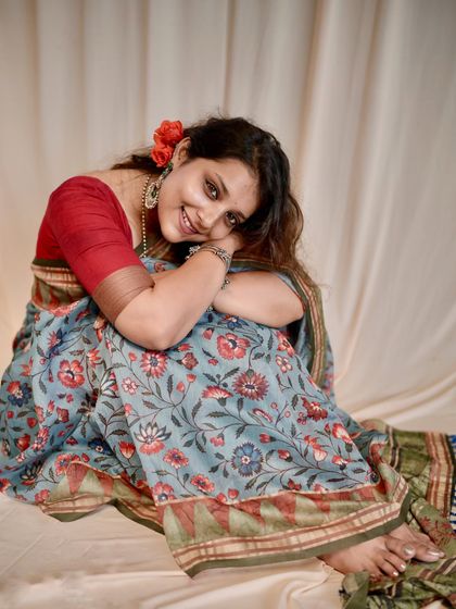 A personal shoot where I styled myself in a floral printed saree, creating a soft, retro-inspired look.