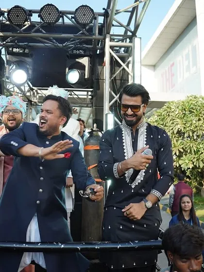 Dancing with the groom's father and friends on the Baraat truck. It's all about creating a unified, high-energy vibe for the entire family.