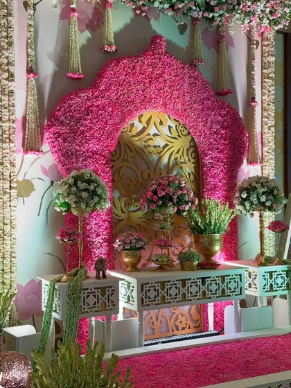 A perfectly symmetrical view of the floral photo corner, showcasing the balance of traditional design, opulent materials, and the sheer abundance of fresh flowers.