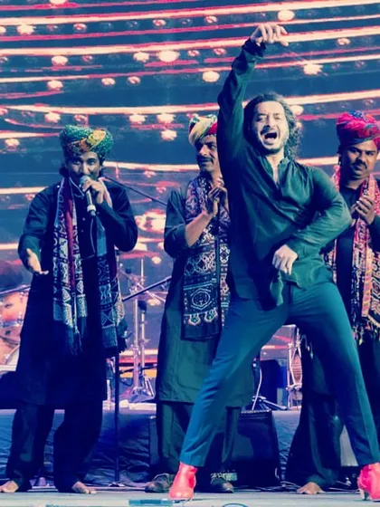 A celebratory moment on stage with my band of Rajasthani folk musicians.