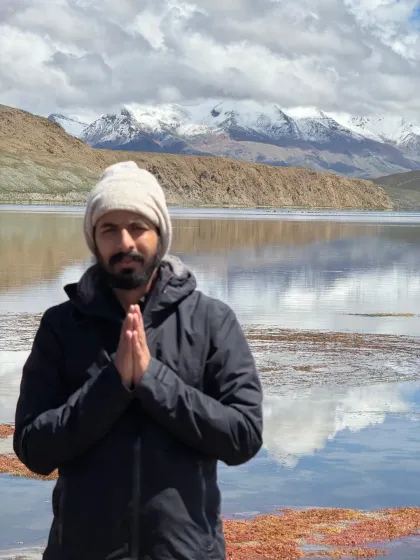 Welcoming fellow seekers with a 'namaste' at the banks of Lake Mansarovar. I am here as a fellow traveler, facilitating this journey for our small sangha.