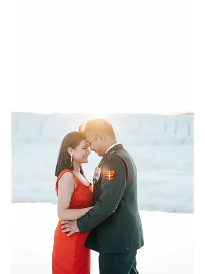 An intimate, sun-drenched portrait of the couple from their army-themed pre-wedding shoot.