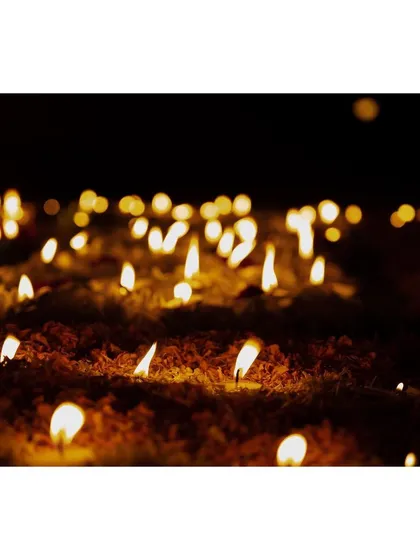 A close-up of countless butter lamps lit by pilgrims at the Mahabodhi Temple. I used a shallow depth of field to create this abstract image of light and prayer, representing the collective faith and hope of the devotees.