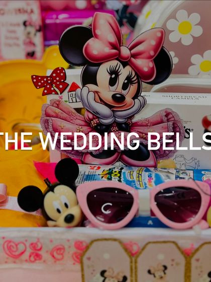 A close-up on the cute details of our Minnie Mouse hamper, including themed sunglasses and character figures.