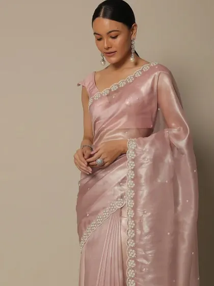 Another look from the Kalki Fashion saree collection. The consistent sleek hair and makeup provide a cohesive look for the e-commerce shoot, allowing the different colored sarees to be the main focus.