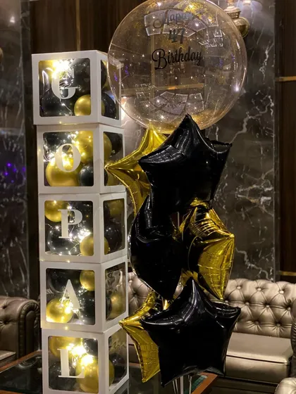 The balloon cubes are lit from within with fairy lights, making them a great decorative piece for an evening party.