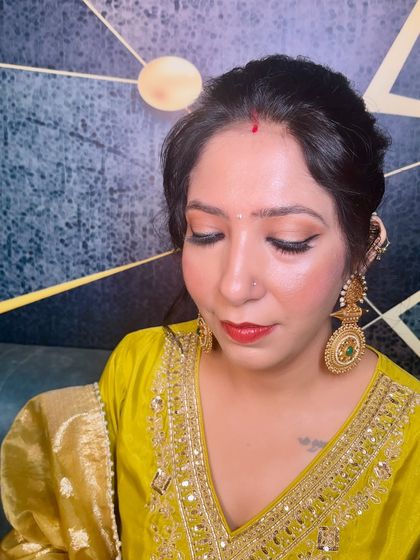 A close-up of the eye makeup for this regal Punjabi look. The soft smokey eye and winged liner add a touch of drama.