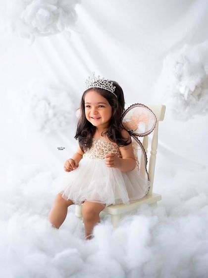 A beautiful, smiling portrait of this little girl in her angel costume.