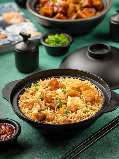 A pot of fried rice from YouMee, presented in a traditional clay pot to keep it warm and add to the authentic experience.