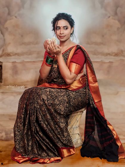 A series of studio portraits featuring a model in a black and red printed saree. The images range from expressive close-ups to elegant full-body shots, demonstrating versatile studio lighting.