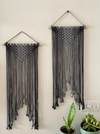 My Ombré grey wall hangings are super cool and aesthetic. This shows two of them together, one slightly larger than the other. They add instant charm and a modern touch to your wall.