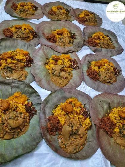 Preparing dozens of Khechri meals on lotus leaves during the busy Kang season in Delhi. It's a lot of work, but worth it to see our customers happy.
