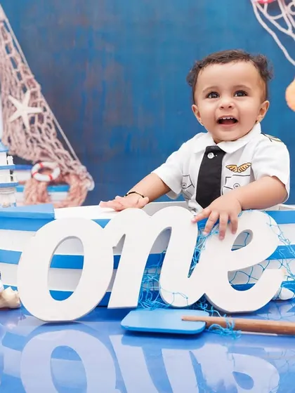 This little sailor is ready for his first birthday adventure! A happy shot from a nautical-themed session.