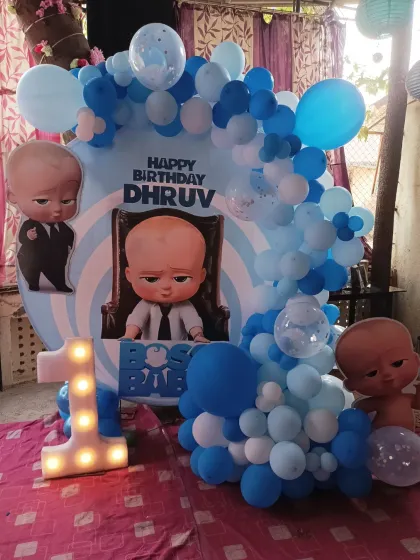 A slightly different angle of the Boss Baby ring decoration, showing the full balloon arch and character placement.