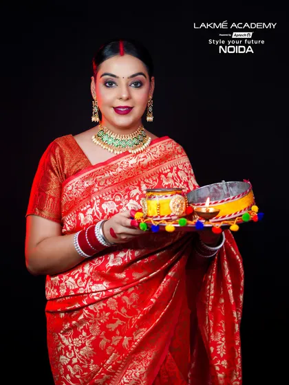 A full-length shot of a woman ready for Karwa Chauth celebrations. The complete look, from the saree to the decorated thali, showcases our attention to cultural details.
