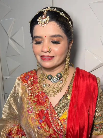 A beautiful, traditional look for the mother of the bride. The makeup is elegant and sophisticated, enhancing her features without being too heavy.