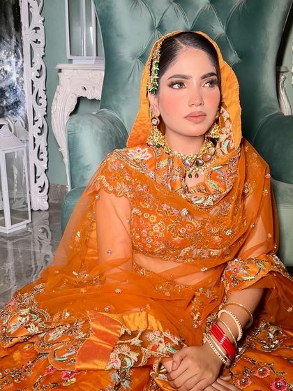 The way the dupatta frames the face and the jewelry is so important. This look is pure royalty.