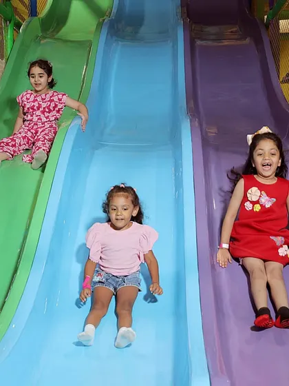 The pure joy of our multi-lane slides. Our indoor play area is designed for endless fun, with safe and exciting structures that let kids race, slide, and laugh all day long.