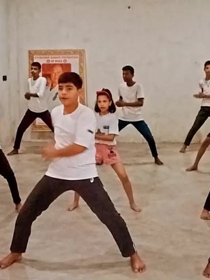 The students are transitioning to the next move in their kata.