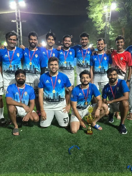 The winning team of the Super Cup with their trophy. These events are a major highlight for our working professionals program.