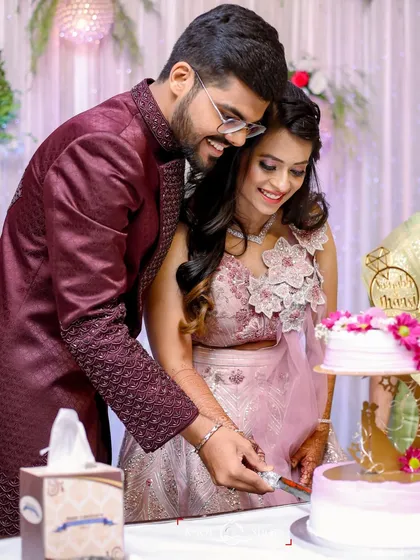 Another angle of the cake cutting, showing the joy and celebration of the moment.