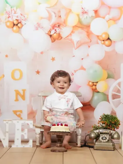A classic first birthday studio session, complete with a festive balloon backdrop, a personal cake, and lots of smiles. My studio is equipped to create the perfect celebratory atmosphere for this special milestone.
