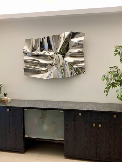 A perfect fit. This installation shows how a contemporary sculpture can complement both modern and traditional furniture.