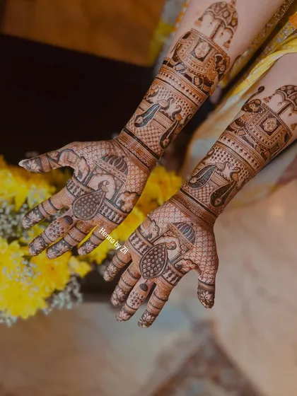 A full view of the traditional design, showing how the motifs on the arms connect with the peacock designs on the palms.
