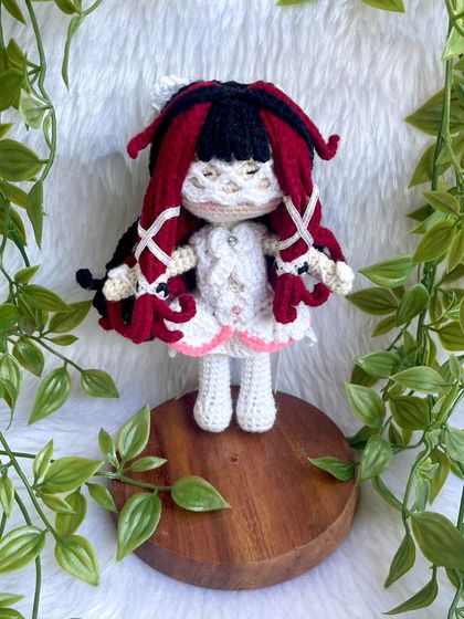 This is Columbina Damselette, a beautifully detailed anime character. The intricate hairstyle with red and black locks and the delicate white dress was a challenge I truly enjoyed creating.