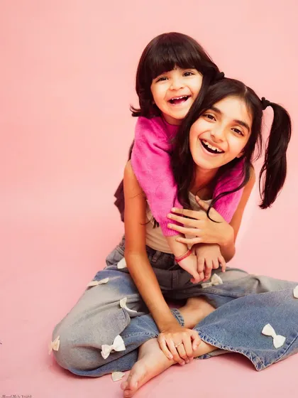 A big hug from a loving big sister. These are the moments they'll cherish when they're older.