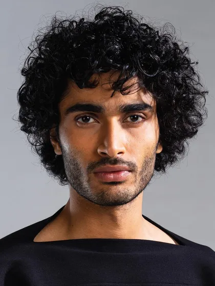 An example of our men's grooming services for a fashion lookbook. We focused on achieving a clean, even skin tone while defining the model's natural hair texture for a sharp, camera-ready finish.