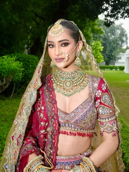 A beautiful portrait of our bride with her dupatta set, ready for her big moment. The makeup is flawless from every angle, ensuring she looks perfect in person and in photos.