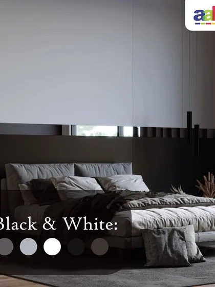 A sleek and modern bedroom design achieved with a timeless black and white palette. The wall features a two-tone finish with a crisp white upper panel and a solid black lower section, creating a bold, graphic look that exudes minimalist elegance.