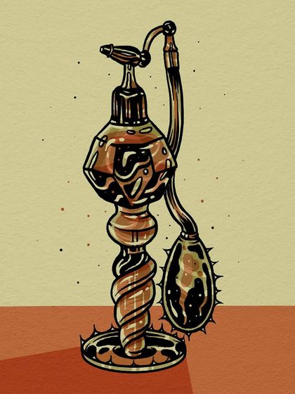A vintage-style atomizer perfume bottle with a thorny base and bulb.