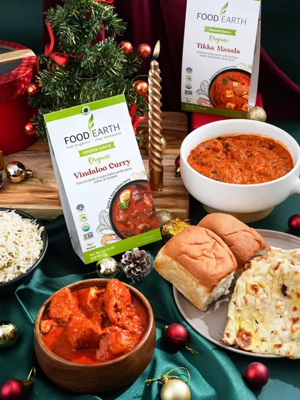 A festive feast styled for a Christmas campaign. I paired these ready-to-cook Indian curry kits with traditional breads and holiday decor to create a warm, inviting scene for a holiday meal at home.