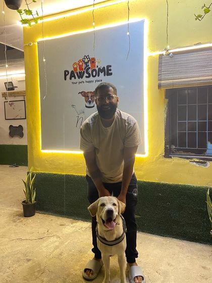 A proud paw-rent with his happy dog, Ditto. It's a joy to see them reunited.