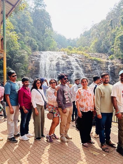 The whole crew lined up for a photo in front of Abbey Falls. It's a popular spot, and we make sure to get there to witness its beauty.