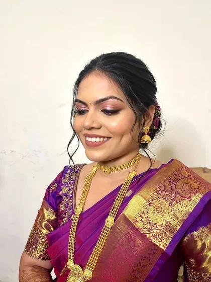 My beautiful engagement bride Yana. This close-up shows her soft glam eye makeup and the lovely messy bun hairstyle we chose, which perfectly complements her traditional silk saree.