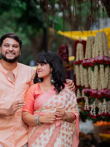 Using the vibrant backdrop of a local flower stall in Bangalore, this portrait captures the couple in a culturally rich and colorful setting. It’s a great example of how I use the environment to enhance a couple's story.