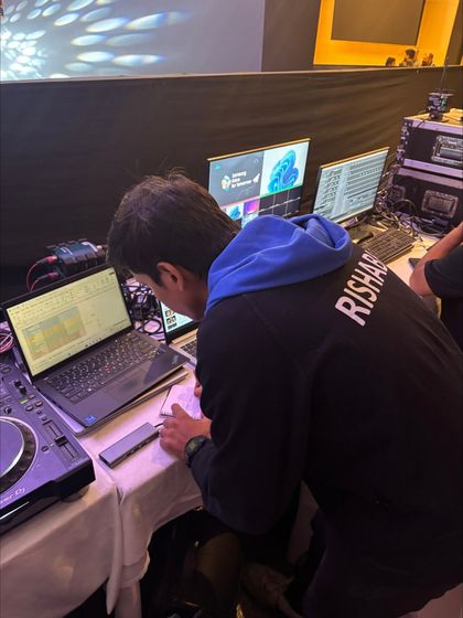 A crew member at the content station for Samsung Solve for Tomorrow. We manage all presentation slides and video content for the show.