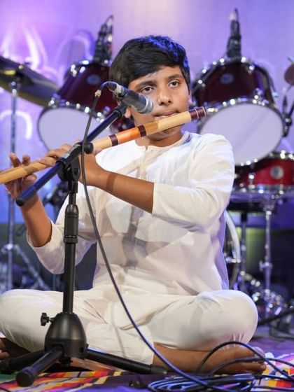 Another angle of student Sairam Shanmukh, capturing his concentration and technique during the flute recital.