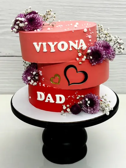 A special topsy-turvy cake I made for my dad and niece, who share a birthday. The three offset tiers represent their unique and special bond.
