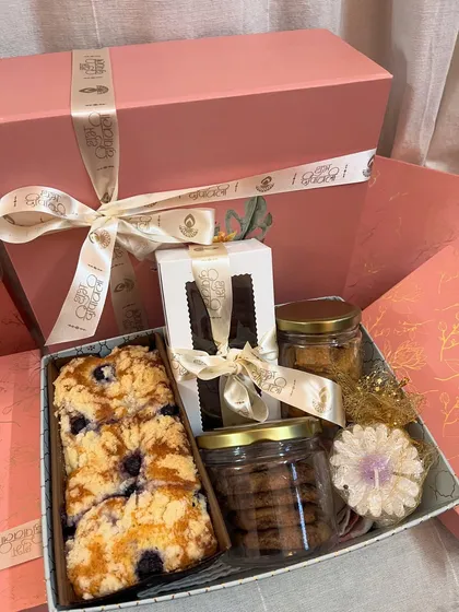 Another angle of my packed hamper, showing how all the goodies fit together. You can see the teacake, brownie box, cookie jars, and a decorative candle, all ready to be gifted.